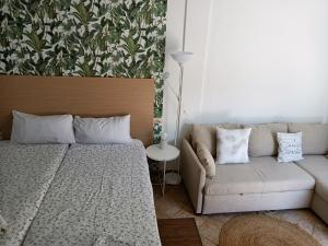 a living room with a couch and a table at Tenerife Paradise 06 Room King - Hotel Rural Fsj in San Juan de la Rambla
