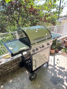 a bbq grill sitting on top of a patio at Flowers Apartments Pula, city center 2 in Pula