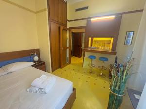 a bedroom with a bed with two towels on it at Appartme Nuova 52 in Milan