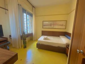 a small bedroom with a bed and a window at Appartme Nuova 52 in Milan