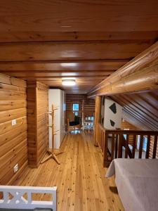 a large room with wooden walls and wooden floors at HonkaRuka, Agrohonka in Ruka