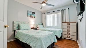 a bedroom with two beds and a dresser and a window at Very Close To IMG Academy, Beaches, Restaurants in Bradenton +44 photos