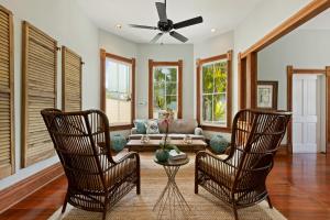 a living room with two chairs and a couch at ARIA at Azul Mansion Key West in Key West