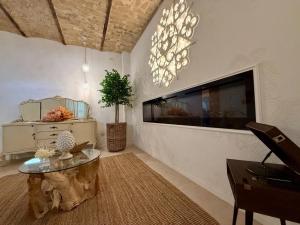 a living room with a table and a large window at La Presentosa b&b in Fossacesia