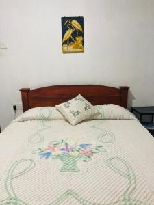 Giường trong phòng chung tại Lake Villa Goyambokka
