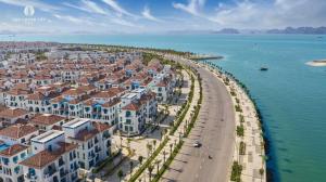 an aerial view of a city next to the water at S Villa Ha Long - City Center, Near Beach - 6BR Private Villa with Pool, Jacuzzi, Sauna, Karaoke in Ha Long +115 photos
