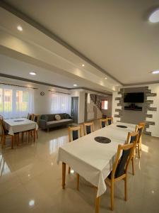 a large dining room with a table and chairs at Casa Alberto in Sovata