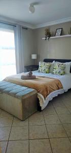 a large bed in a bedroom with at OCEAN VIEW, Blouberg Beach, Sunsets & Kite Beach in Bloubergstrand +46 photos