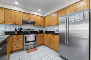 Kuchyň nebo kuchyňský kout v ubytování Cozy Family Home Netflix Backyard and Quiet Area