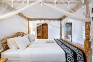 Ένα ή περισσότερα κρεβάτια σε δωμάτιο στο salaoni villa ubud