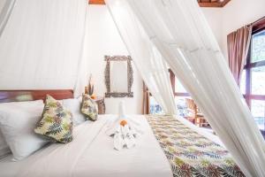 Un pat sau paturi într-o cameră la villa restu 1