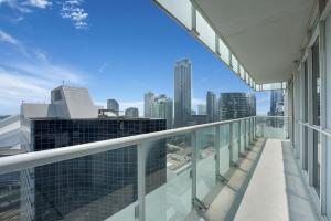 a balcony of a building with a view of the city at Lakeview Unit - sleeps 11 people near CN Tower Union Rogers Centre and Convention Centre in Toronto