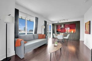 a living room with a couch and a table at Lakeview Unit - sleeps 11 people near CN Tower Union Rogers Centre and Convention Centre in Toronto
