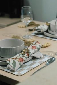 a table with plates and dishes on a table at Affordable CBD 2Beds and Ducted AC Walk to everything in Brisbane