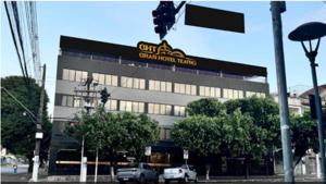 a building with a sign on the side of it at Gran hotel teatro in Manaus