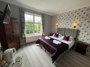 Ένα ή περισσότερα κρεβάτια σε δωμάτιο στο The Ardingly Inn