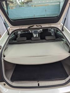 an open trunk of a car with the trunk open at White car - TOYOTA PRIUS MODEL 2010 in Kigali