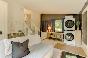 a living room with a couch and a washing machine at half Mi to Dtwn Frankfort Cozy Fernhaven Home! in Frankfort