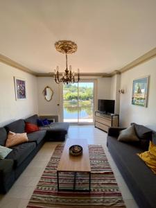 a living room with a couch and a coffee table at Gîte Massibel au coeur de Brassac in Brassac