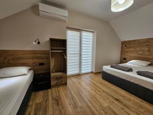 Ένα ή περισσότερα κρεβάτια σε δωμάτιο στο Villa Karta