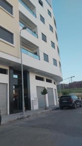 a car parked in front of a building at modern apartment in Tangier