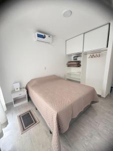 Ένα ή περισσότερα κρεβάτια σε δωμάτιο στο Alojamiento Termas de Federacion a 200 metros +10 φωτογραφίες