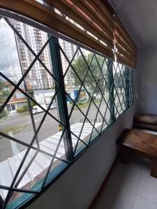 a window in a room with a bench next to it at centro bogota in Bogotá