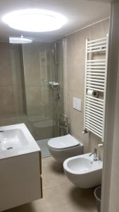 a bathroom with a sink and a toilet and a shower at la casa sui sassi B in Matera