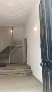 an empty hallway with stairs in a building at la casa sui sassi B in Matera
