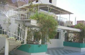 a white building with stairs and plants on it at Windsor Hotel Luxor 您在盧克索的第二個家 in Luxor