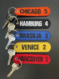 a bunch of keys attached to a bunch of signs at LOFT maison 5ch 5sdb 5wc Lille 200m2 avec extérieur in Lambersart +16 photos