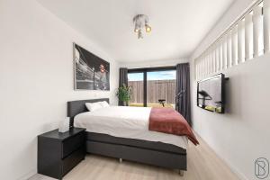 Ένα ή περισσότερα κρεβάτια σε δωμάτιο στο Modern holiday villa Oudenaarde