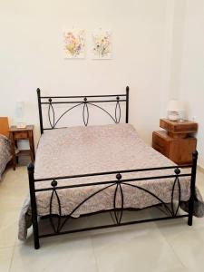 Ένα ή περισσότερα κρεβάτια σε δωμάτιο στο Iris' Home