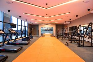 a gym with treadmills and elliptical machines at Studio b2b in Florianópolis
