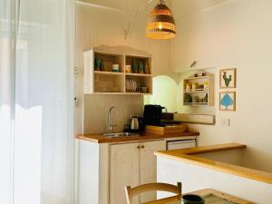 a kitchen with a sink and a counter top at A Casa del Console apartment in Manfredonia