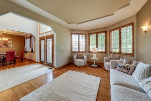 a living room with a couch and a table at Game Room and Deck Family Home in Chicago Area! in Matteson