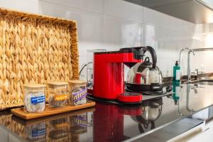 a coffee maker on a counter in a kitchen at Casa M&M in Espirdo +13 photos