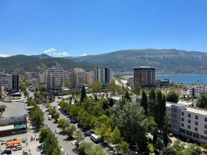 a view of a city with mountains in the background at Il tramonto in Vlorë