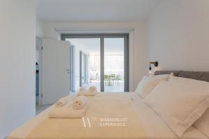 Katil atau katil-katil dalam bilik di Wanderlust Experience Costa Sud