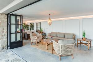 a living room with a couch and chairs and a table at VILLA EMBIL GETARIA in Getaria