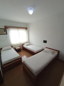 Giường trong phòng chung tại hotel tamburi +30 ảnh