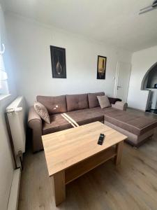 a living room with a couch and a coffee table at Melissa luxury Apartment in Bijelo Brdo