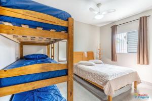a bedroom with two bunk beds and a bed at Casa Gruta do Macaco - MA02I in Solemar +41 photos