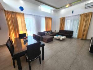 a living room with a couch and a table at Unique 3 Bedrooms Villa las Palmas 41 in Puerto Plata