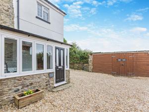 a detached house with a patio and a fence at 2 Bed in Ilfracombe 81464 in Ilfracombe