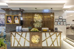 a lobby of a casino hotel with a reception desk at Gacine Hotel Tahlia فندق غسن التحلية in Al Madinah