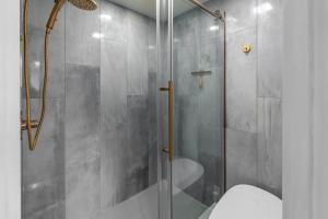 a bathroom with a glass shower with a toilet at Crestwood 1211 Standard Studio Loft in Snowmass Village +14 photos