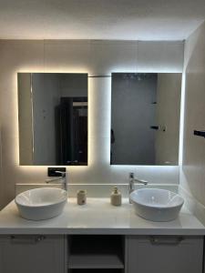 a bathroom with two sinks and a large mirror at Holiday Home Turkuaz in Oludeniz