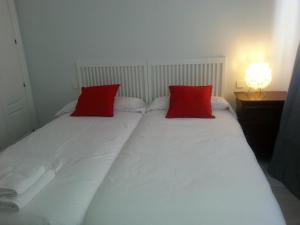 Posteľ alebo postele v izbe v ubytovaní Apartamento Buhaira