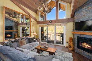 a living room with a couch and a fireplace at Crestwood 3308 Deluxe 1 Bedroom Plus Loft in Snowmass Village